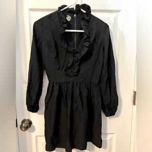 Vintage 1960s black micro mini dress, ruffled low neckline. Sz 7
